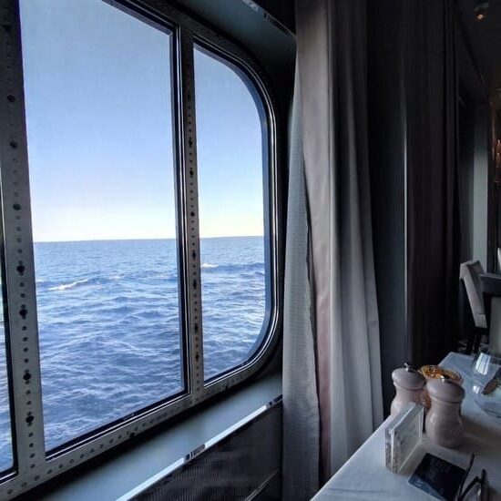 Table on cruise ship with view of ocean