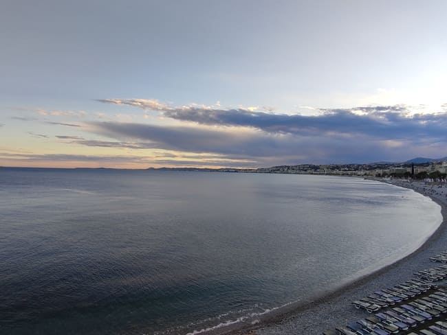 Calm sea and beach at sunset