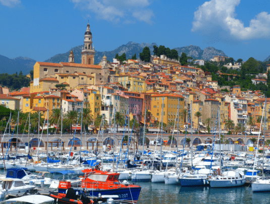 Pretty town on hillside with harbour and boats