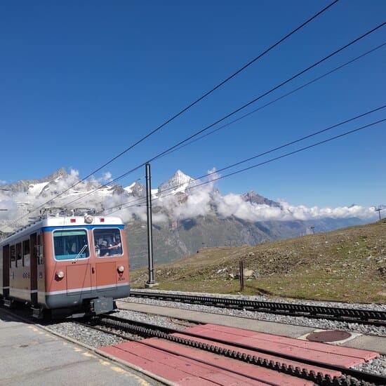 Gornergrat Cogwheel Railway with tracks and snow-capped mountains