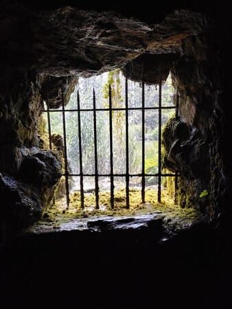 View from grotto through barred windows to lake