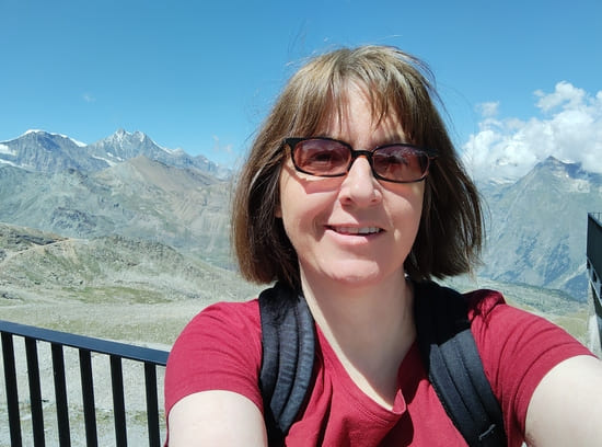 Author in front of mountain scenery