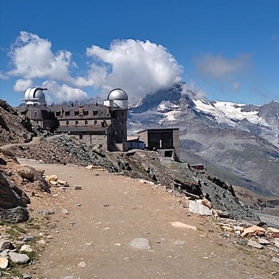 Barren mountain scenery with luxury hotel Kulmhotel resembling a moon station