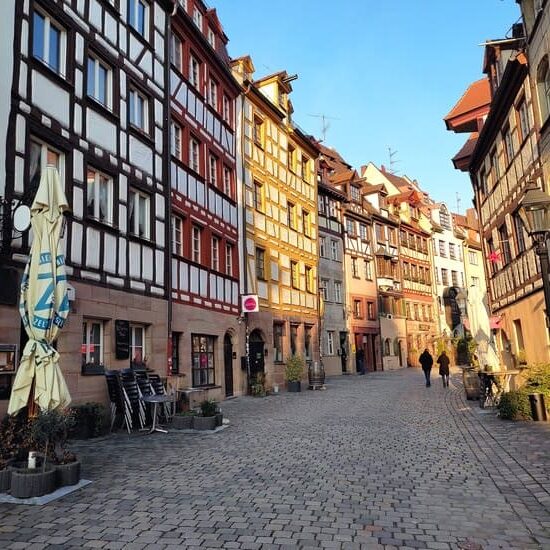 Cobble-stone-street with half-timbered houses in Nuremberg, Germany