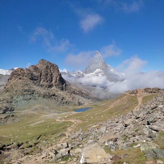 Mountain scenery with small lake and Matterhorn in distance