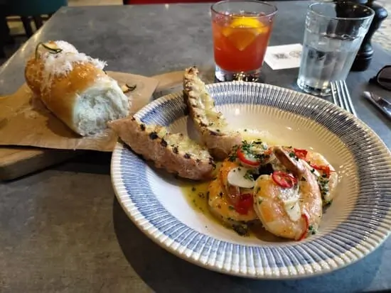 Garlic bread and plate with prawns and toasted bread as part of Unlimited Dining on Royal Caribbean