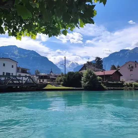 Bright blue river with mountain in background