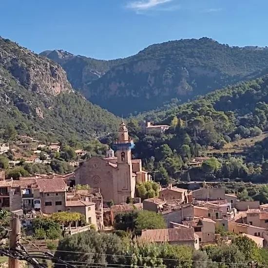 Church and town of Valldemossa surrounded by hills