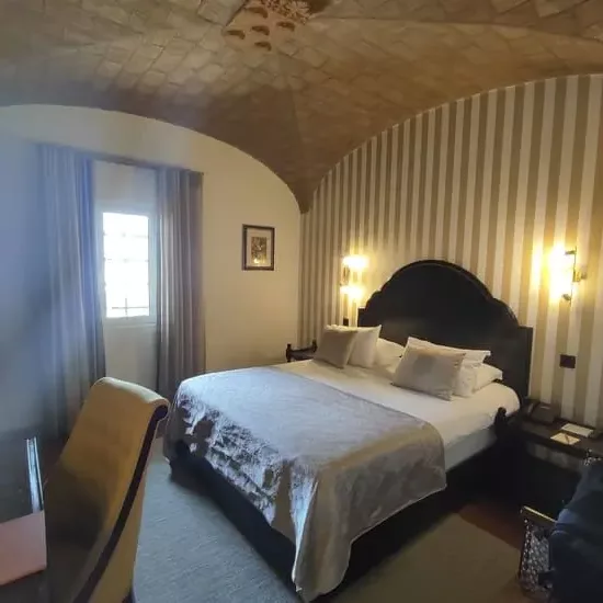 Hotel room with domed ceiling and king-size bed