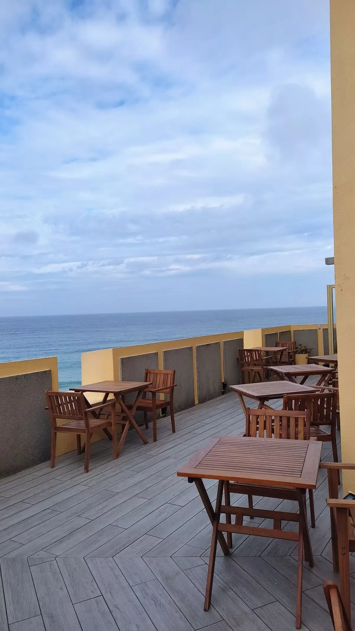 Terrace of hotel Fortaleza do Guinco with view over sea