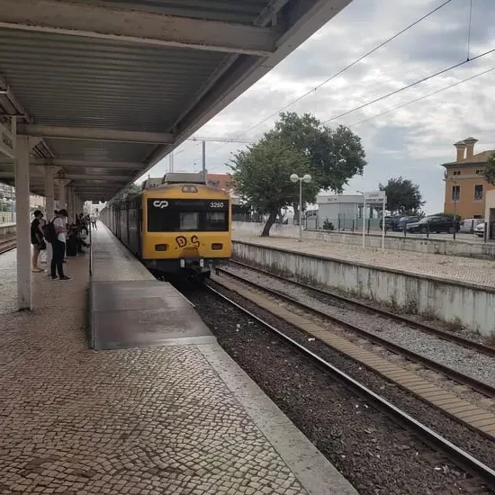 Train platform in Cascais with incoming train