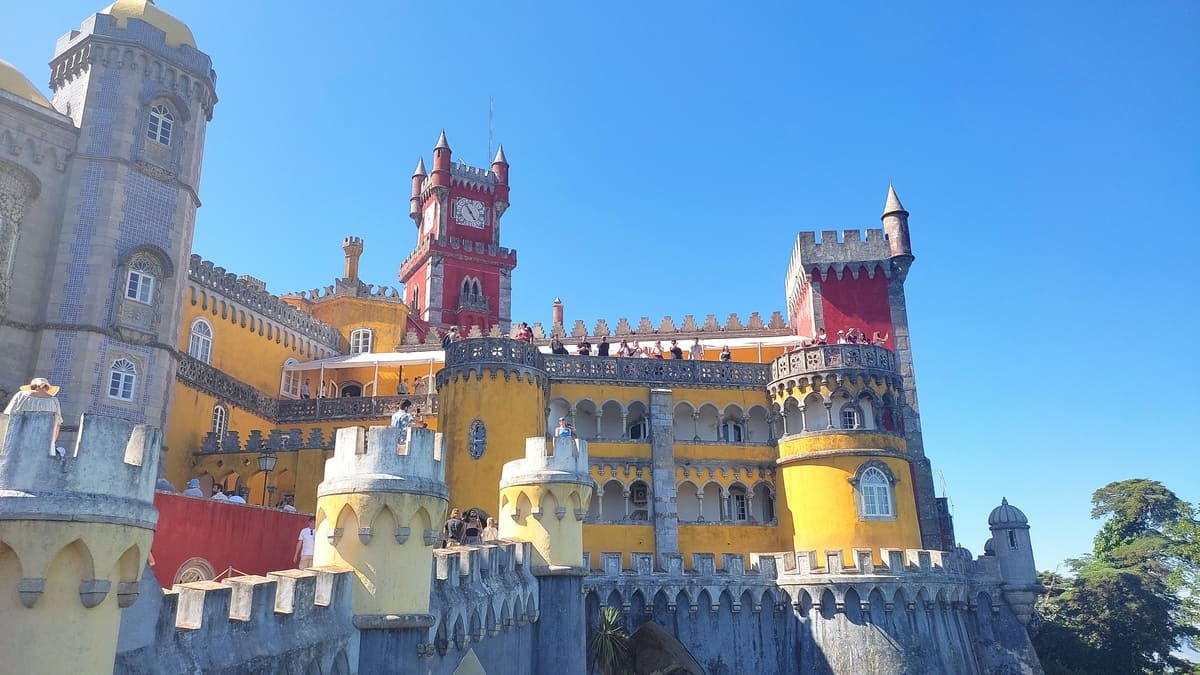 With its vibrant colors - sunflower yellow and terrakotta red - and ornate decorations Pena Palace seems to be straight from a Fairy Tale. Various crenellations and towers are an invitation for exploration.