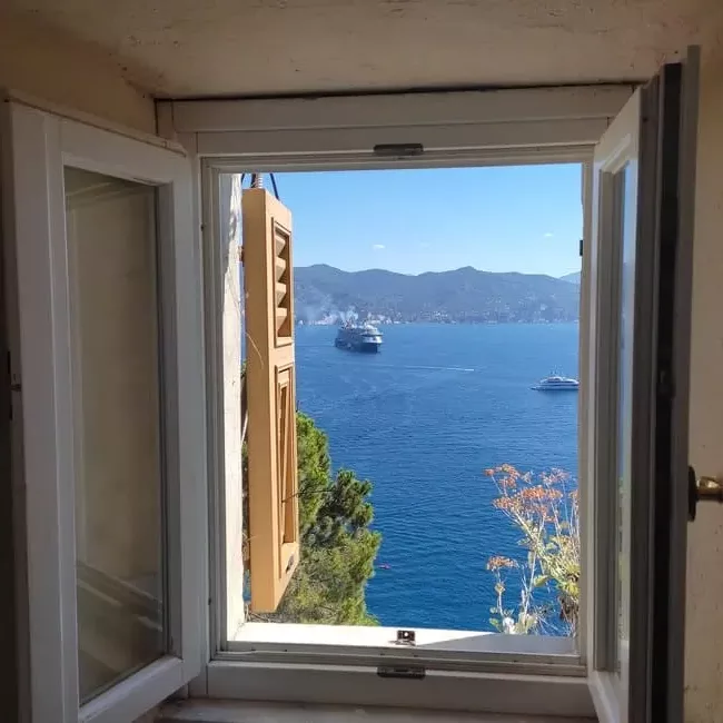 Window in Castello Brown in Portofino with view of Med and cruise ship out in the harbor