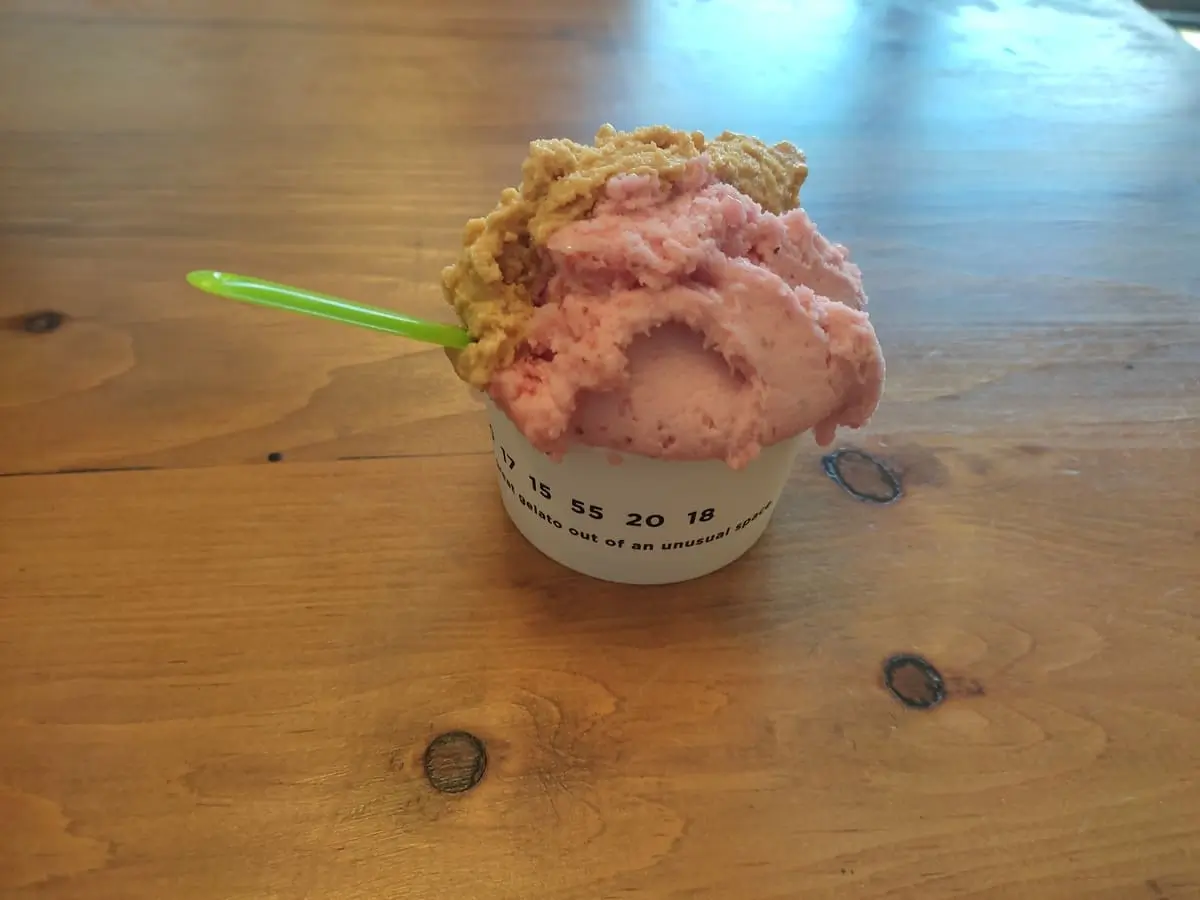 Small tub with strawberry and caramel ice cream