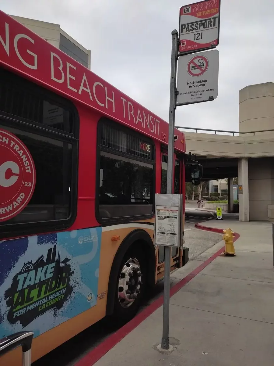 OC and Passport bus stop near Catalina Express in Long Beach with colorful Long Beach Transit Bus for Route 121 parked next to it