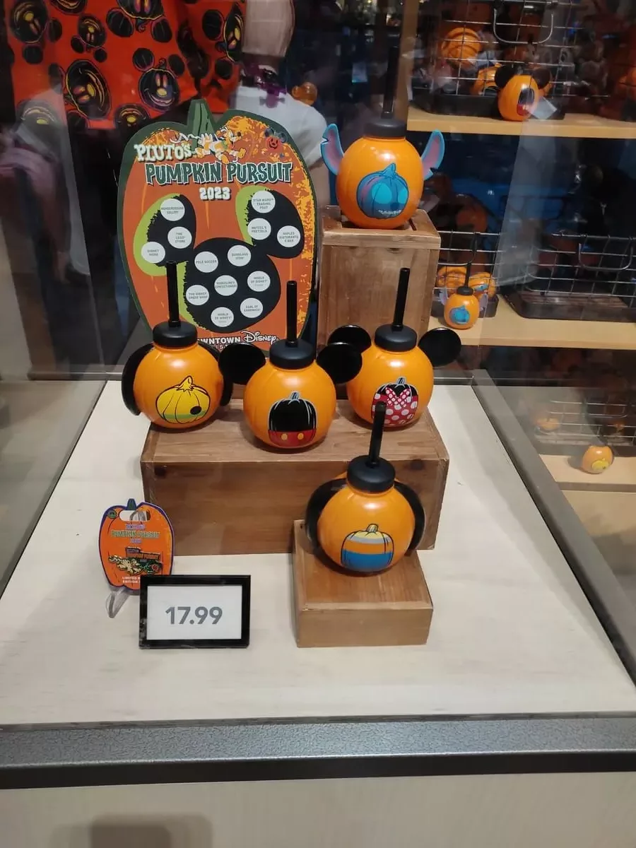 Case with sticker card and choice of redemption prices for Pluto's Pumpkin Pursuit. Prices are five different sippy cups in the shape of a pumpkin, styled for different Disney characters.