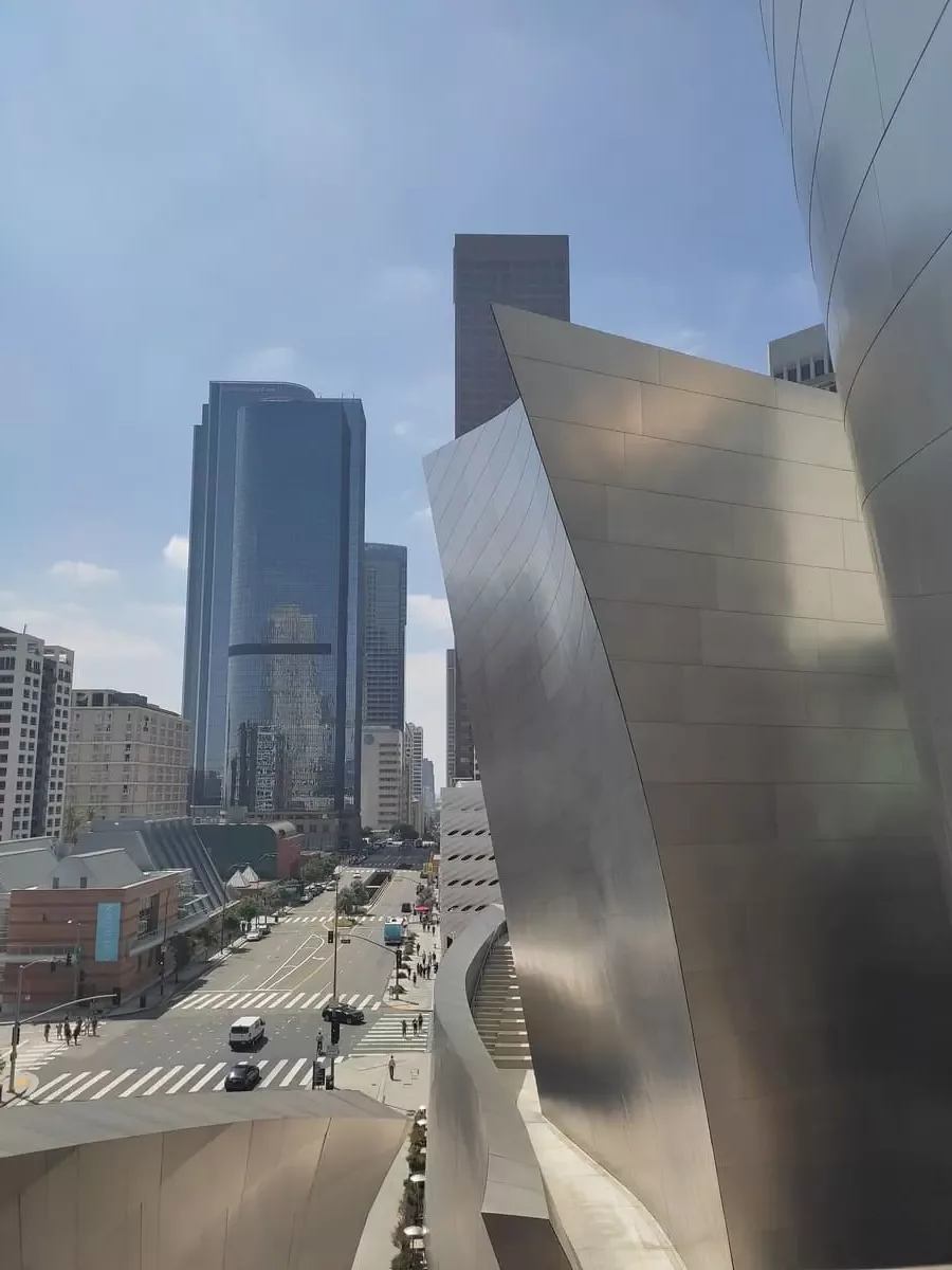 View of downtown LA from Walt Disney Concert Hall. Large glass skyscrapers reflect the scenery.