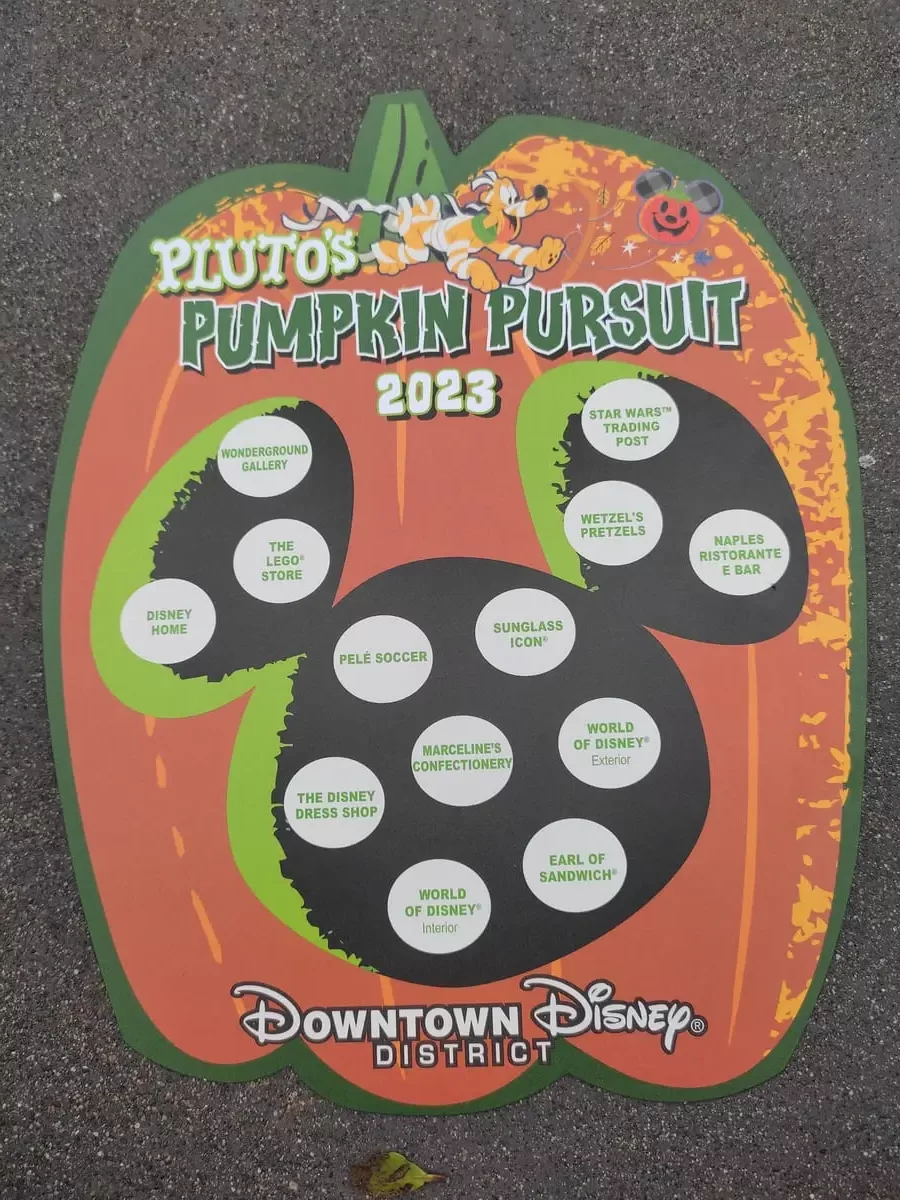 Pumpkin shaped card with heading: Pluto's Pumpkin Pursuit 2023. Underneath there is a Mickey head shape with 13 white circles. Each names a location and marks the place to stick a sticker.