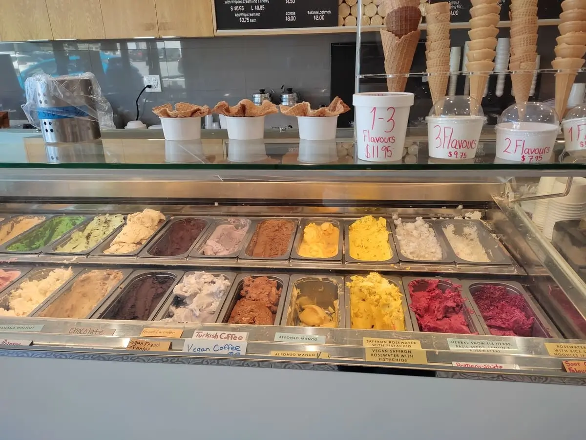 Large variety of different colorful ice cream flavors at Mashti Malone. There are several unusual flavors with Middle Eastern flavor profiles offered.