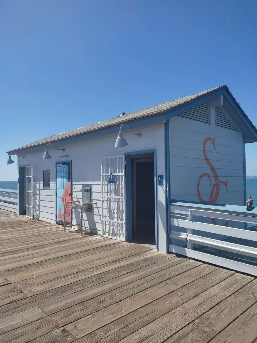 This cute white clapboard building on the San Clemente pier houses a public restroom