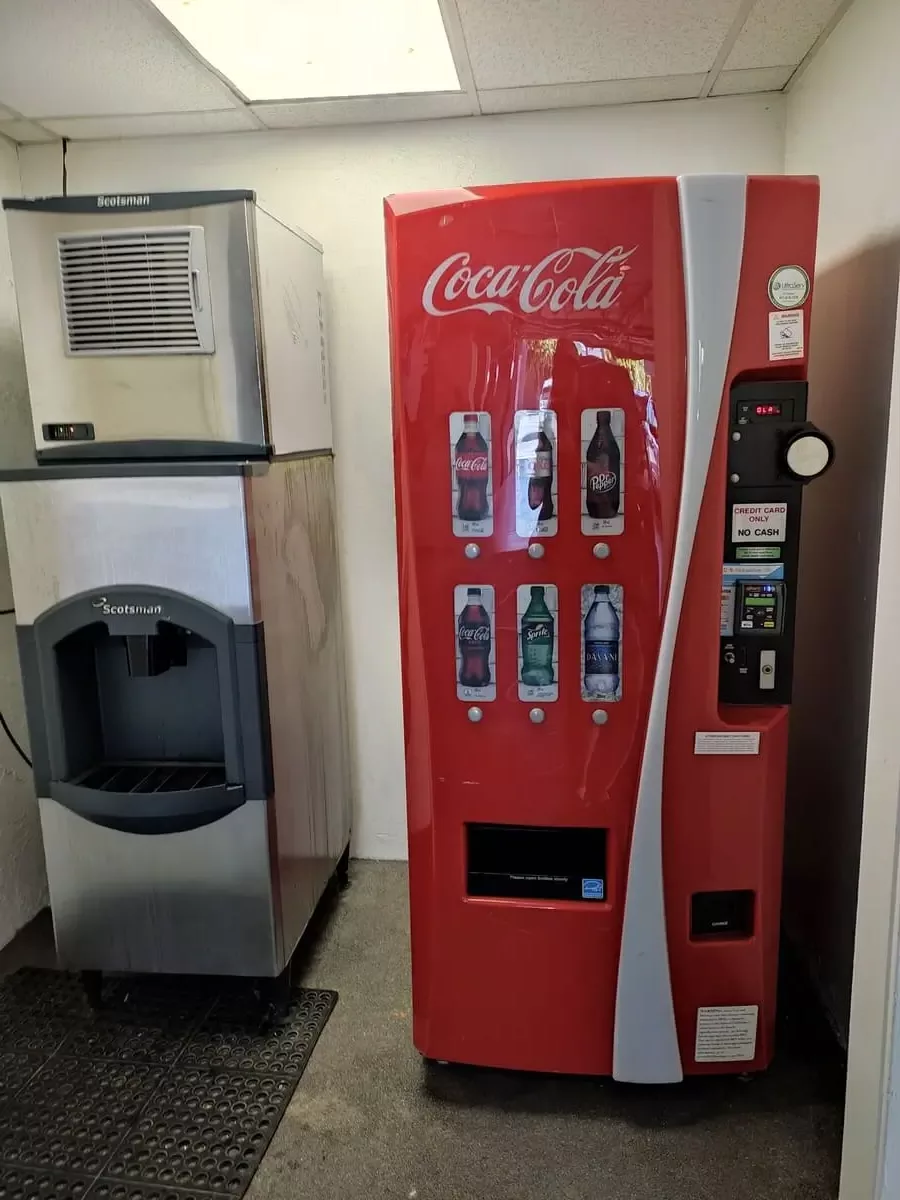 Ice machine and Coke soda machine in parking area of Inn at Venice Beach