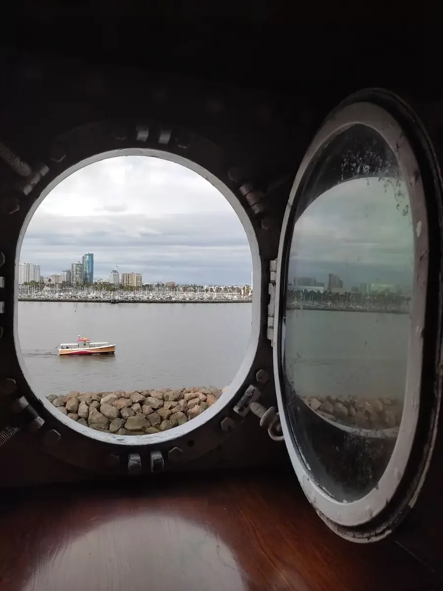 Long Beach skyline seen through a porthole on Queen Mary