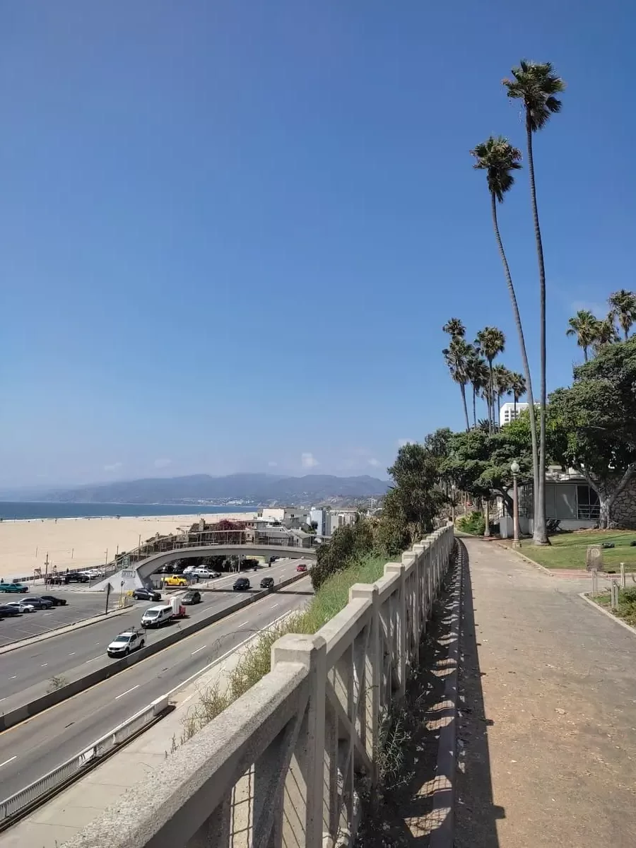 Palisades Park in Santa Monica with view of freeway, sandy beach and Pacific ocean