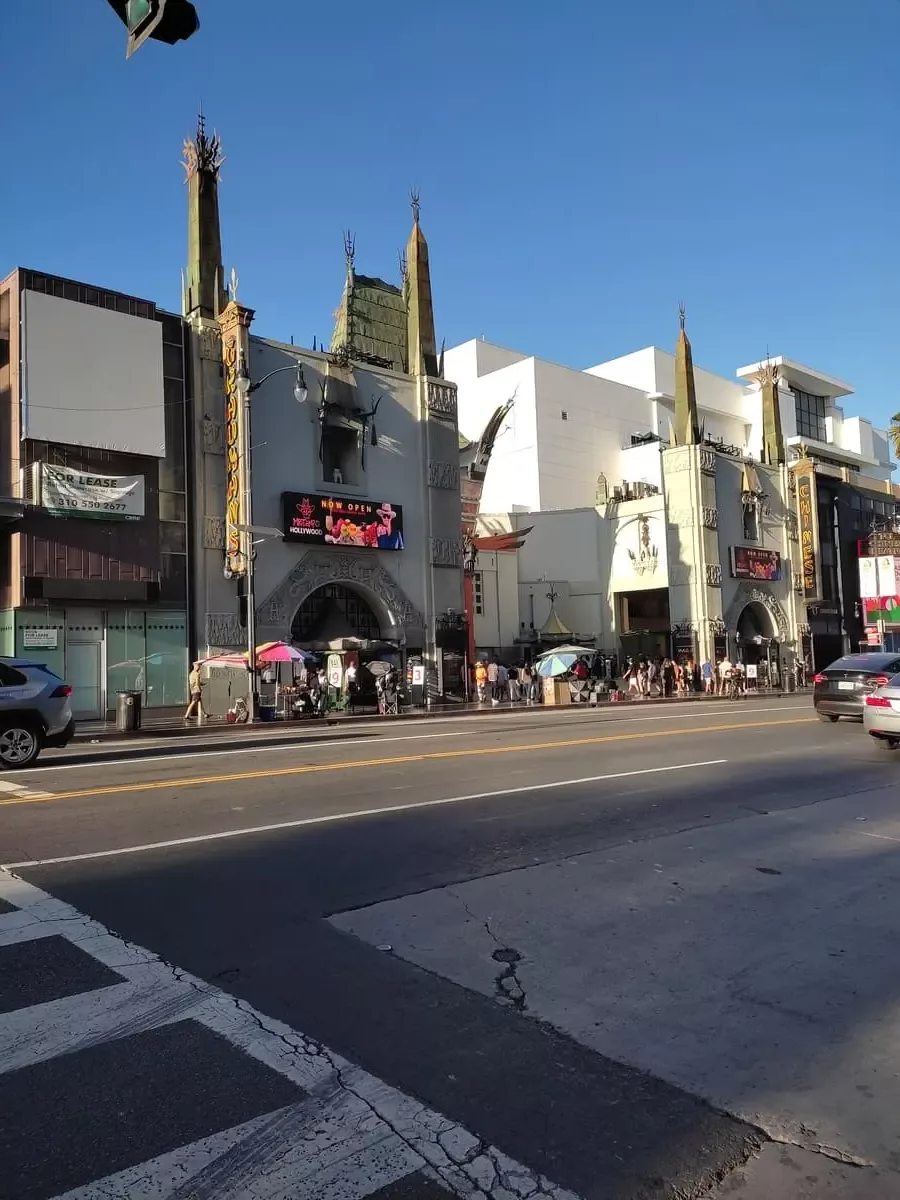 Tourists crowd the sidewalk in Hollywood in front of the Chinese Theater