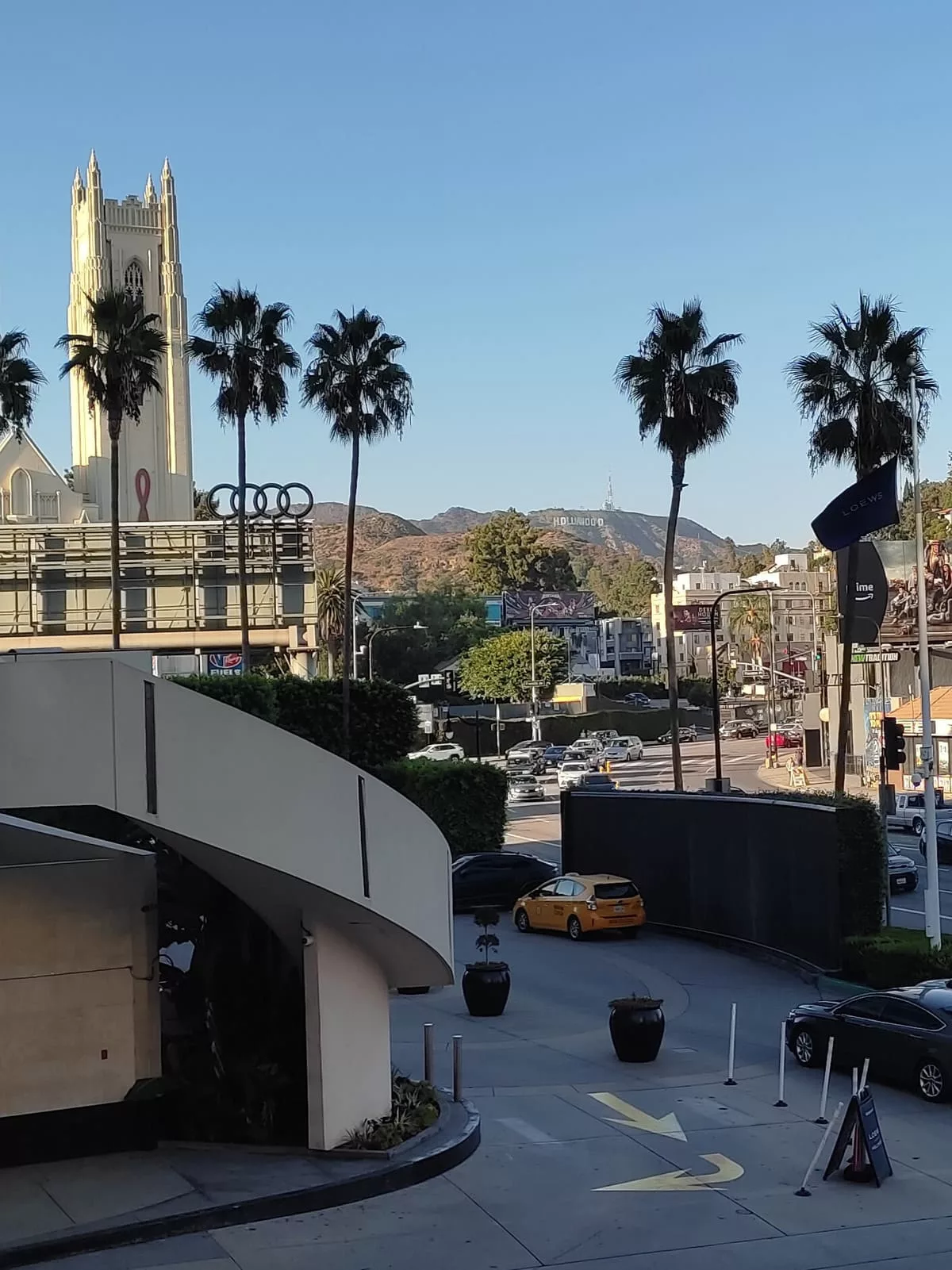 The Ovation Shopping Center is your best bet for a photo of the Hollywood Sign. But unless you have a good camera your picture will likely be blurry as it is quite a distance away.