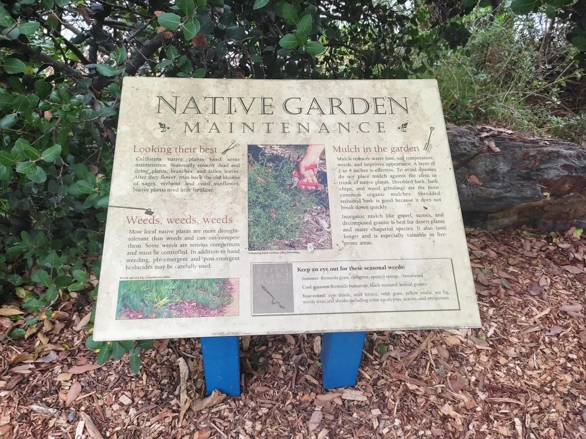 Dirty sign with information about Native Garden Maintenance at San Diego Botanic Garden in Encinitas
