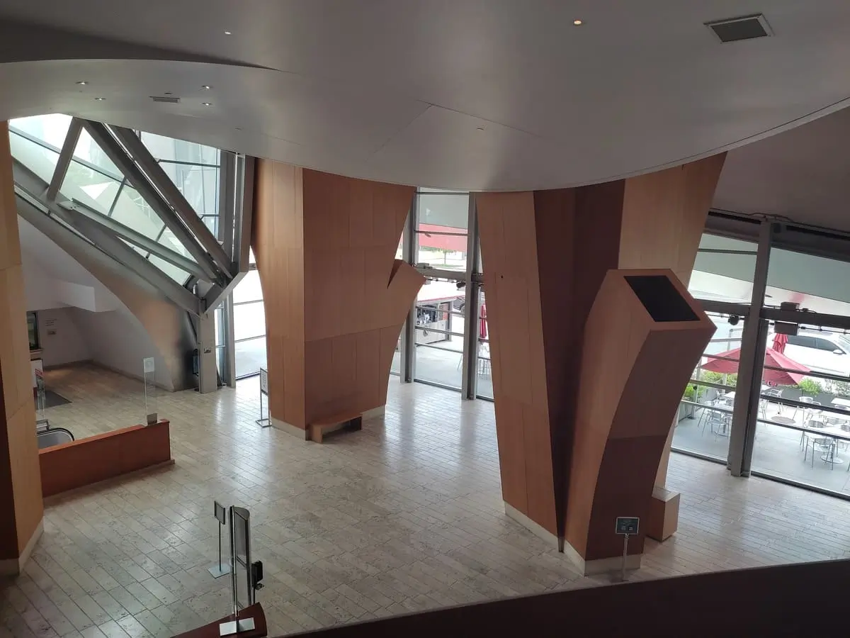Lobby of Disney Concert Hall with large glass doors and wooden columns