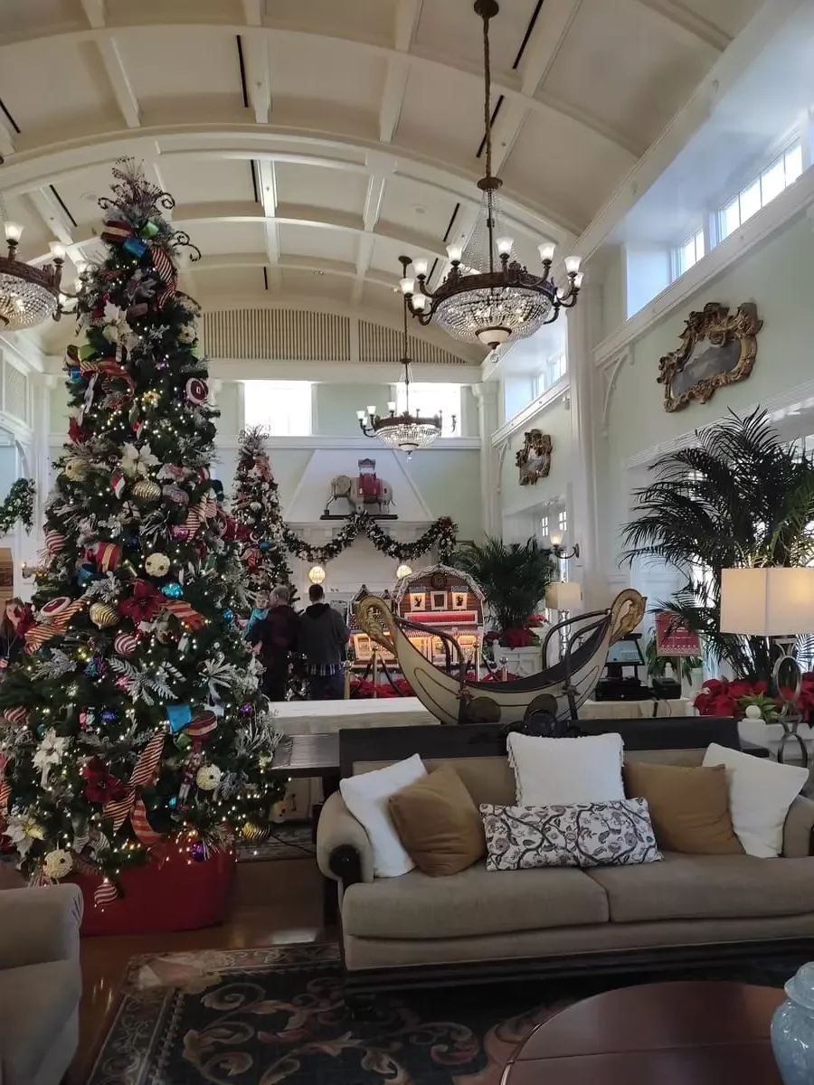 Lobby of Boardwalk Inn with large Christmas Tree with traditional decorations