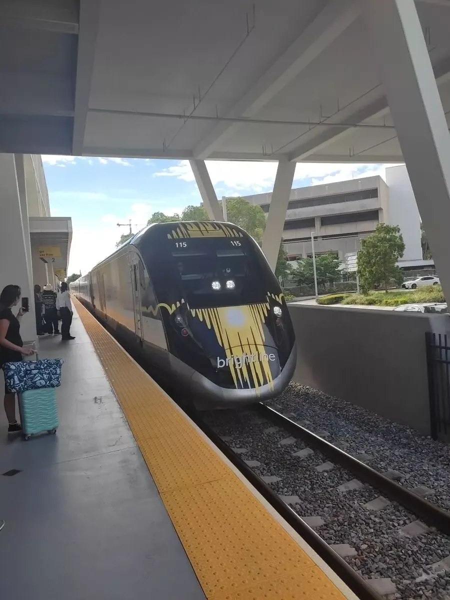 Modern Brightline Train arriving at platform in Fort Lauderdale
