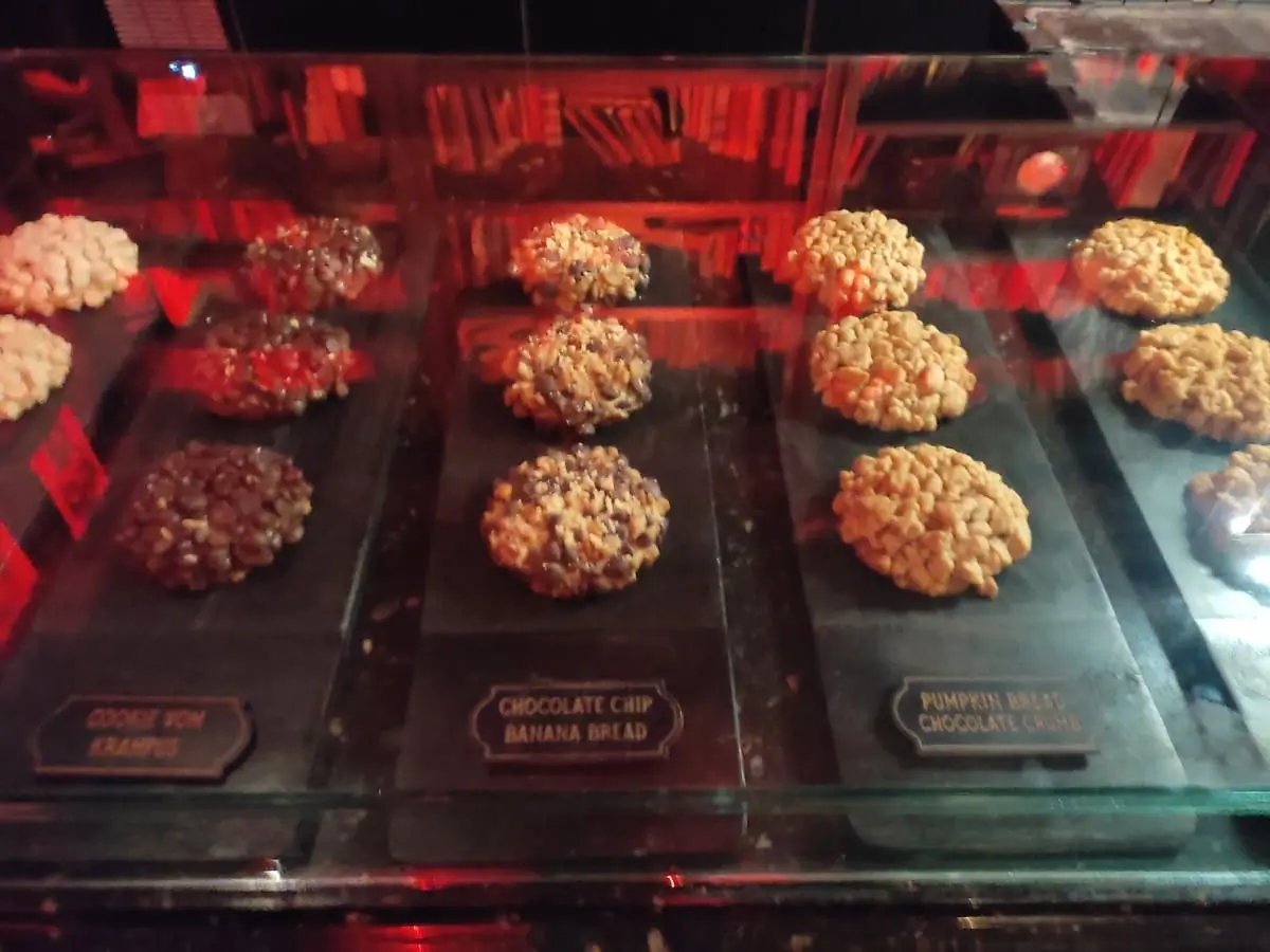 A glass case showcases the various cookies with a label