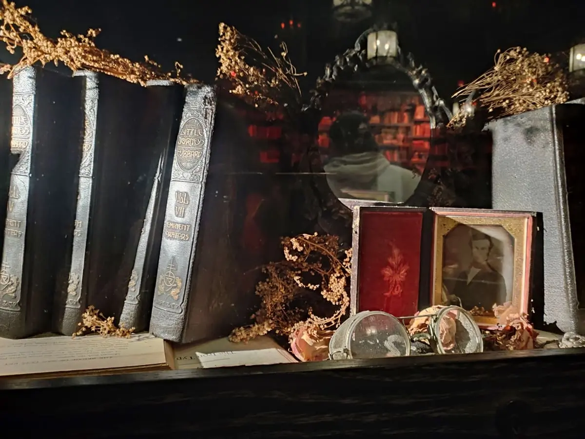 Display at Gideon's Bakehouse with leather-bound books, herbs and black-and-white picture