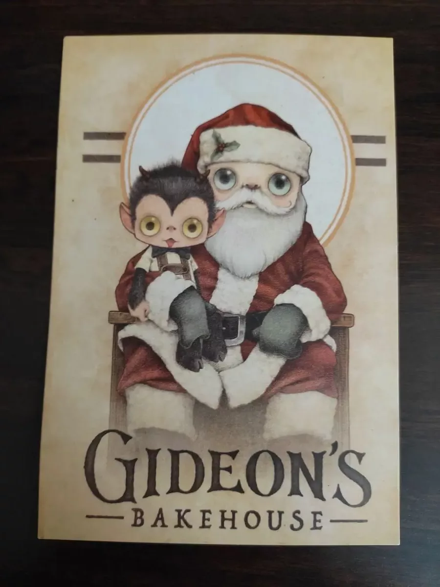 Santa and a monkey on front of menu card for Gideon's Bakehouse