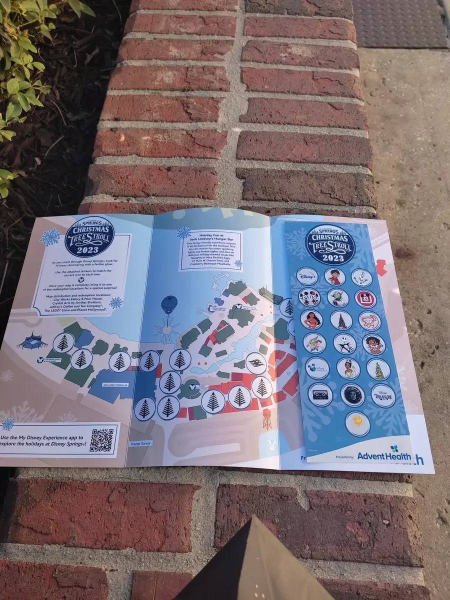Map of Disney Springs indicating location of Christmas trees and sticker sheet