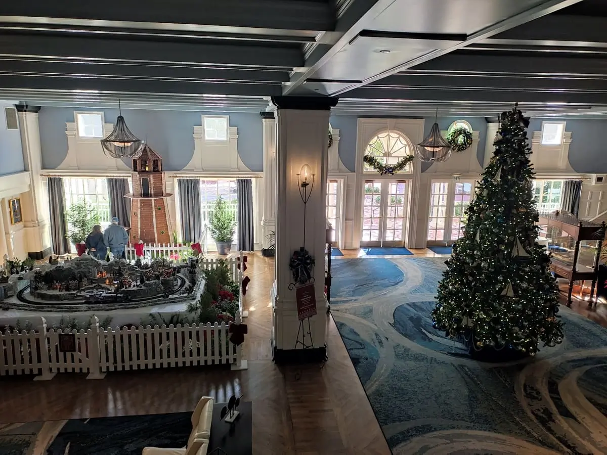 Lobby of Disney's Yacht Club with Christmas Tree, Gingerbread Lighthouse, and Winter-Themed Miniature Railroad