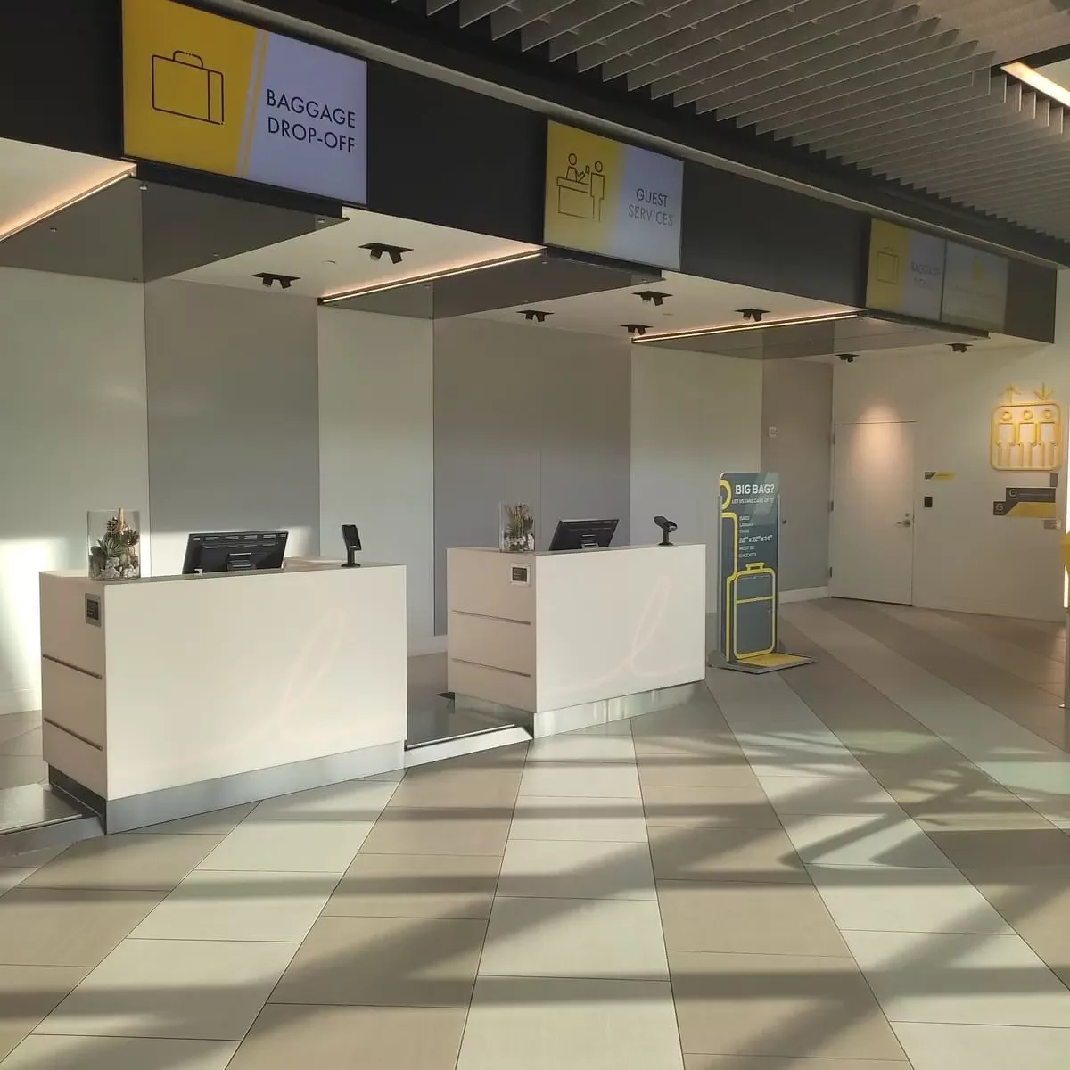 Empty entrance hall of Fort Lauderdale's Brightline Station with Baggage Drop-off and Guest Services
