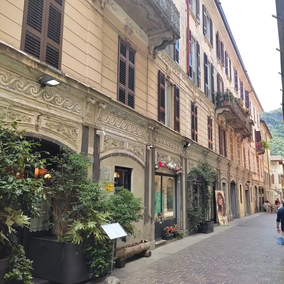 Ornate buildings with plants in Como, Italy