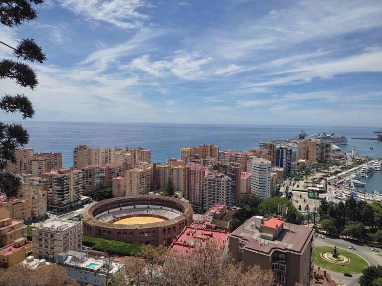 View of port and bull fighting ring in Malaga