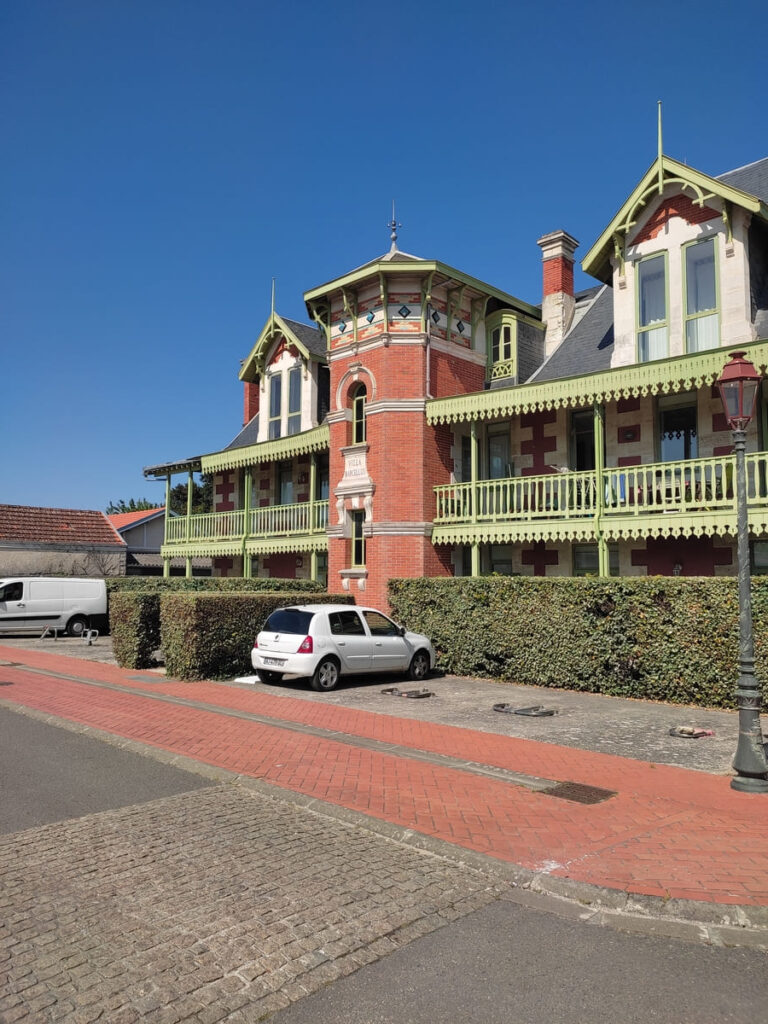 Solac building with pale green balcony