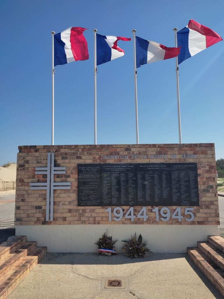 War Memorial Liberation de la Pointe de Grave in Soulac-sur-Mer with French flags on top