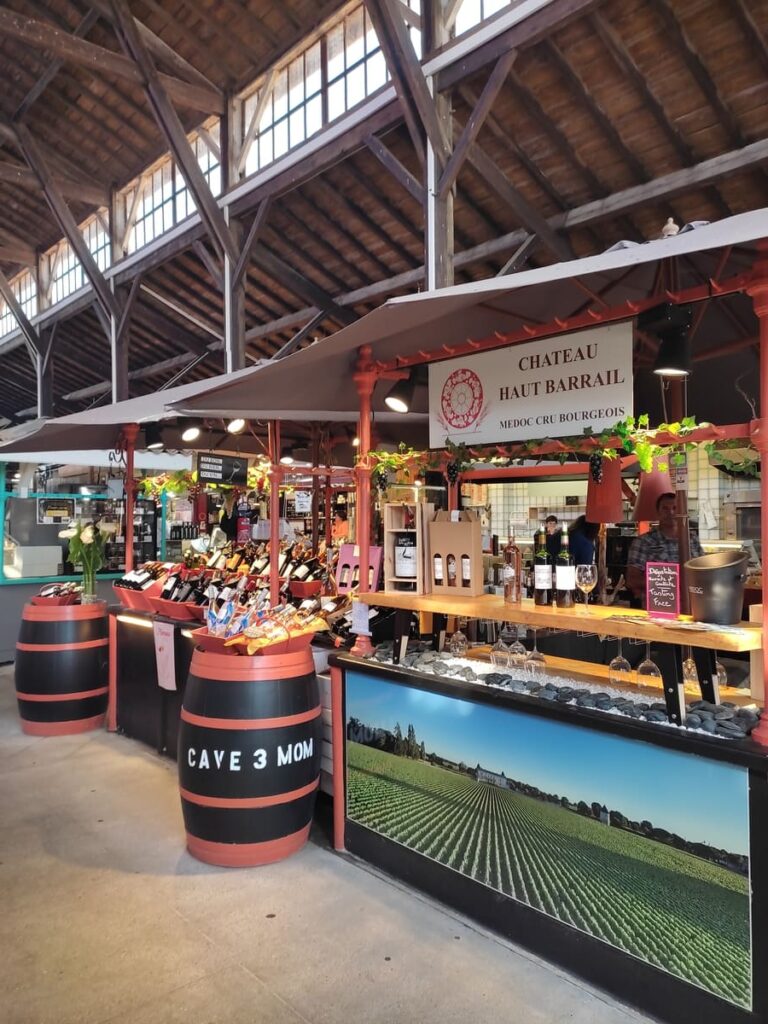 Stall selling French wines in market hall