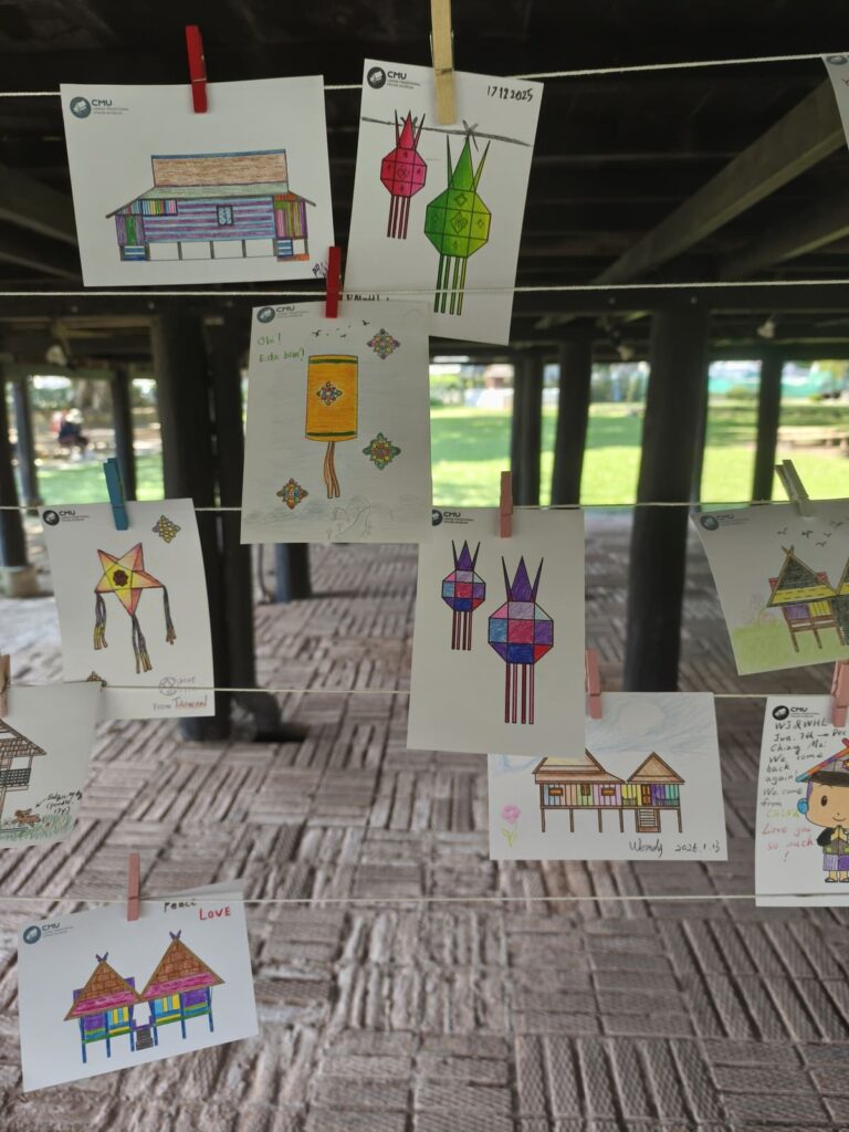 Colored in pages hung up on a line