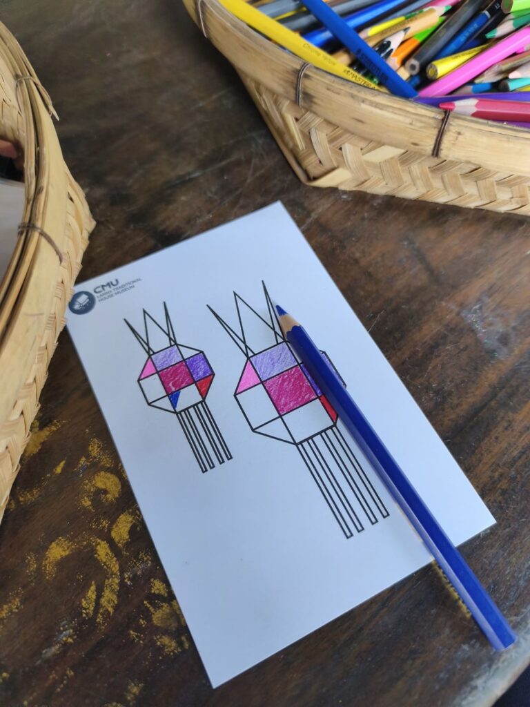 Coloring page with pencil on table