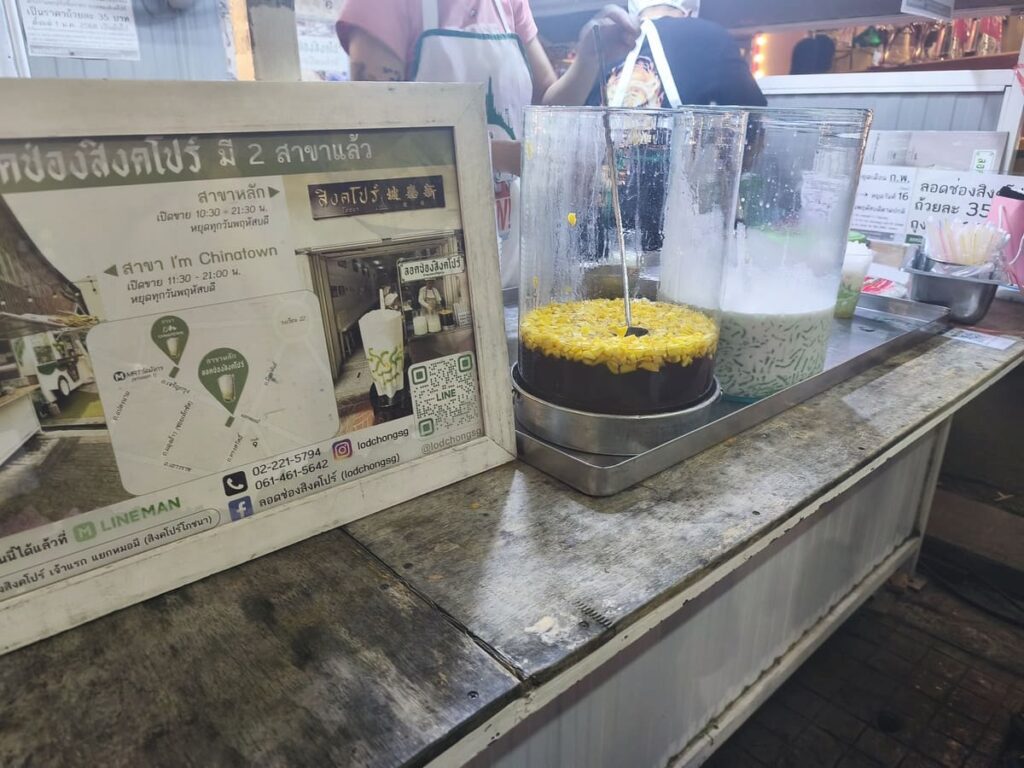 Stall with large jugs containing a milky liquid