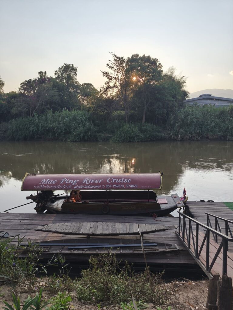 Boat on Ping River at dusk