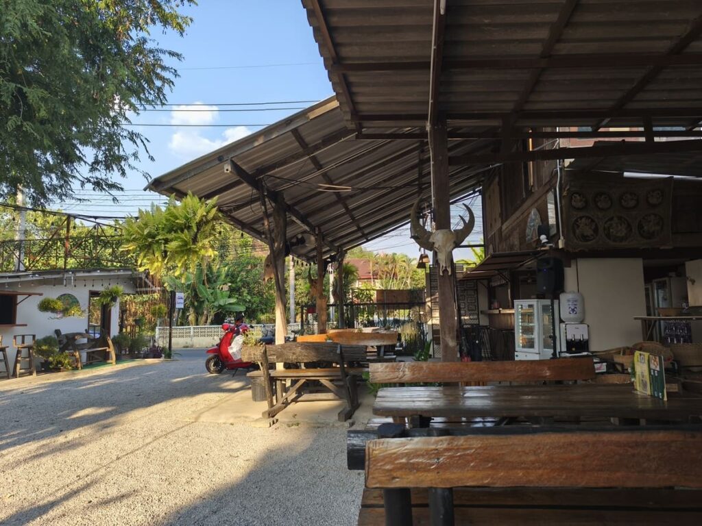 Benches in shade next to restaurant