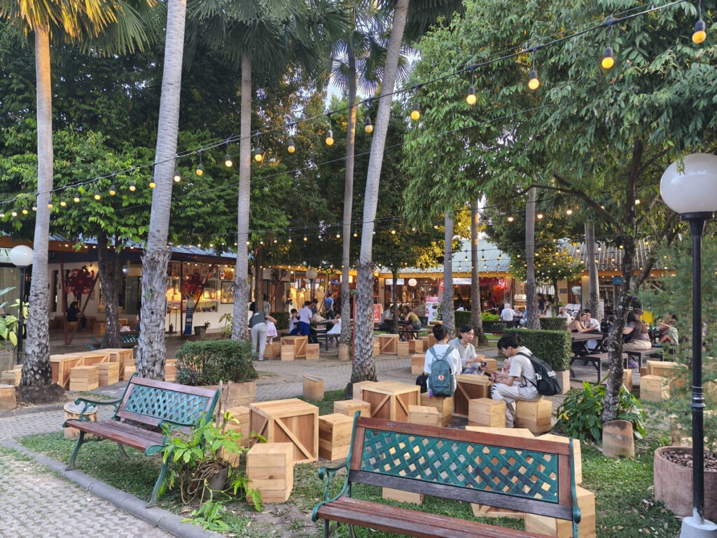 Little plaza with trees, benches and tables